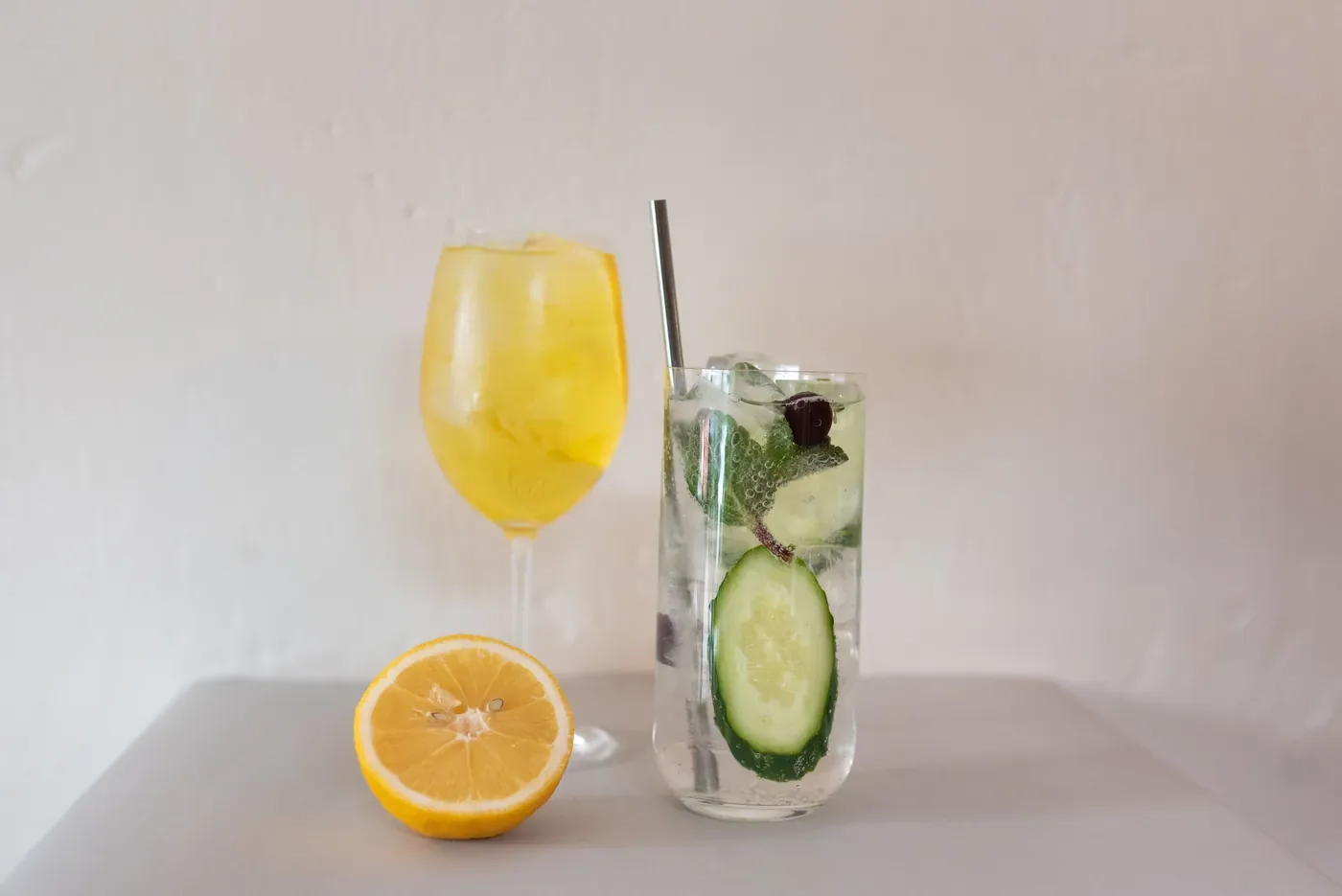 Two zero-proof drinks with citrus and cucumber
