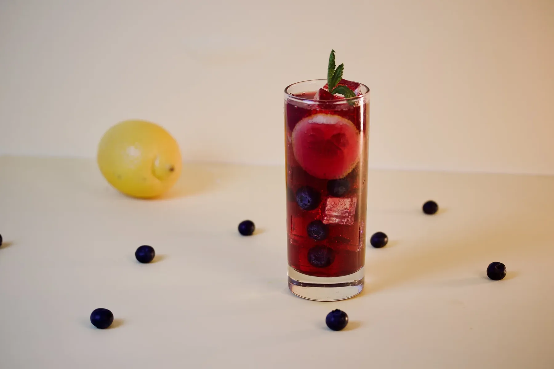 A berry highball with ice